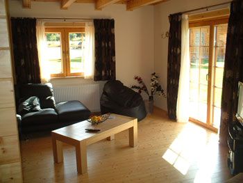 Enjoy the cosy ambiance of a log cabin holiday