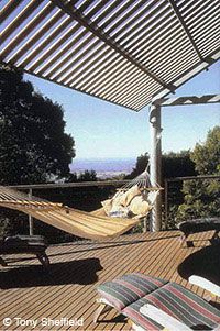 Self-catering rainforest tree house with large decking
