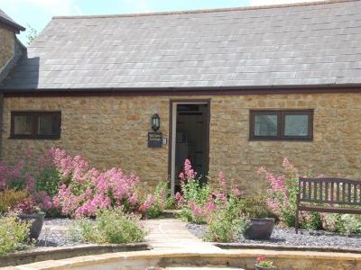 Bakers Mill Holiday Cottages nestling in The Axe Valley within dorsets Area of Outstanding Natural Beauty