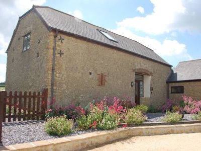 Bakers Mill Holiday Cottages nestling in The Axe Valley within dorsets Area of Outstanding Natural Beauty