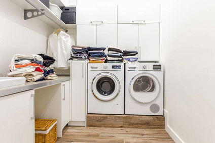 a holiday cottage wuth a washing machine and tumble dryer in utility room