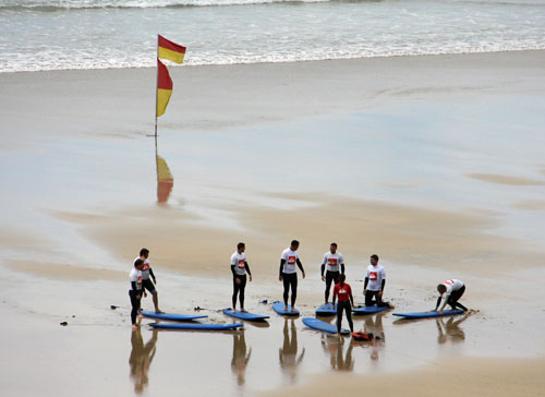 Surfing on a Newqau beach