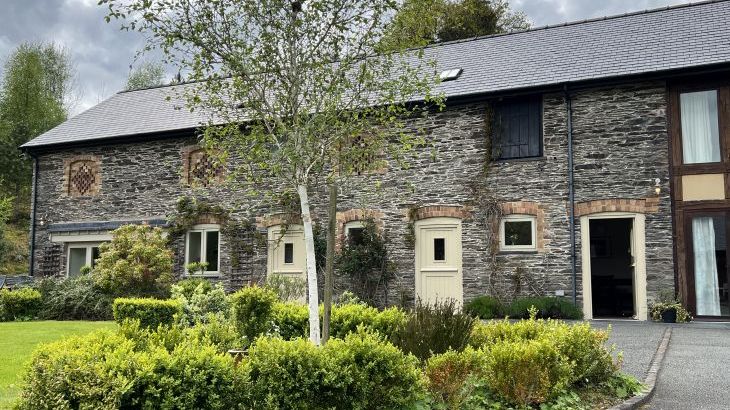 Large group accommodation with a swimming pool   in Mid Wales