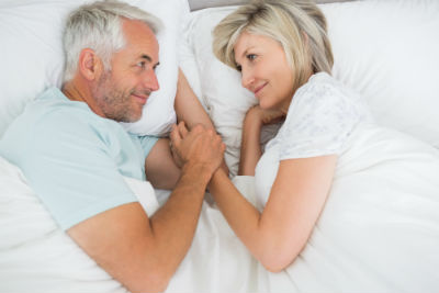 Romantic Couple in Big Bed